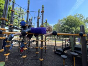 image of boy on the playset